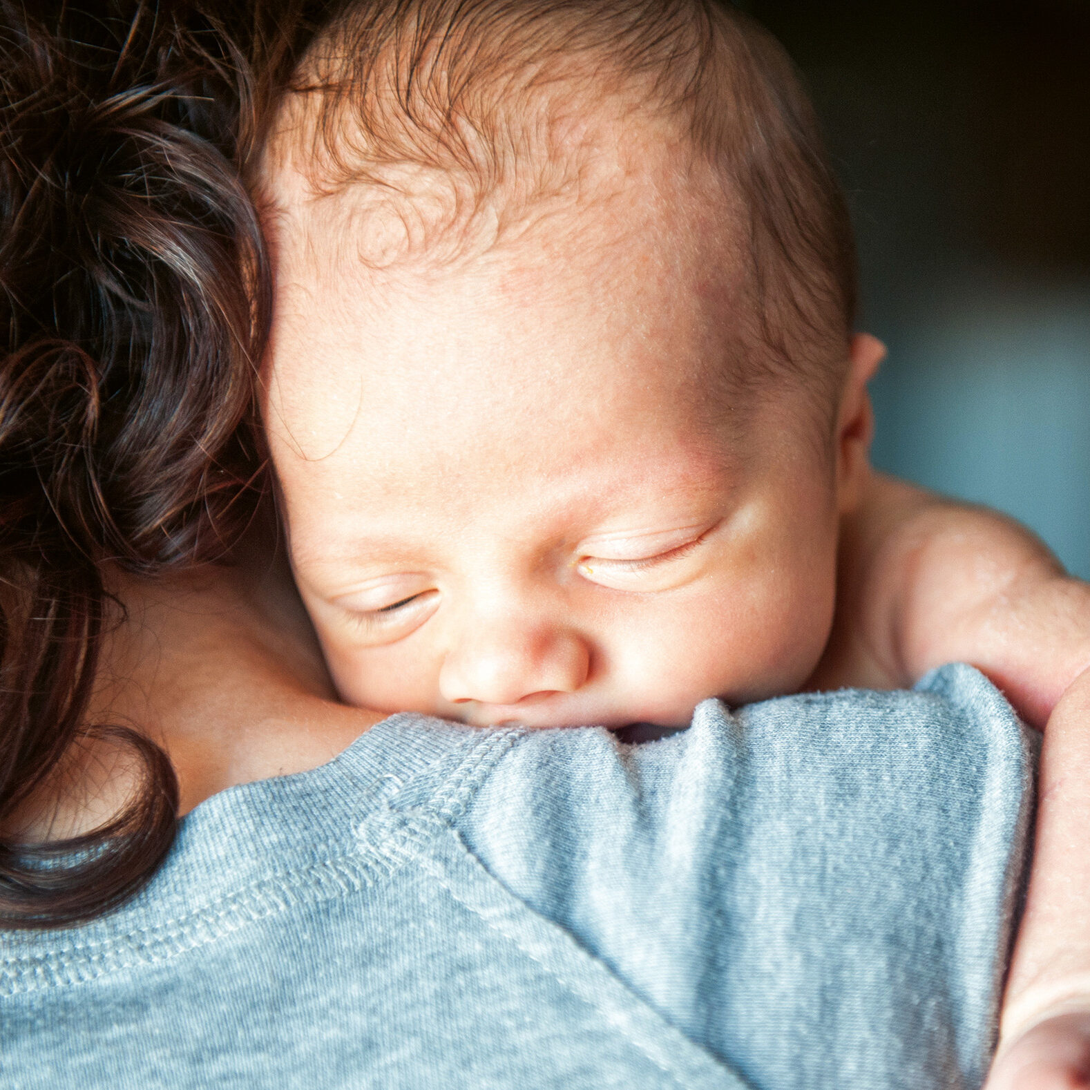 Newborn baby in the arms of his mother